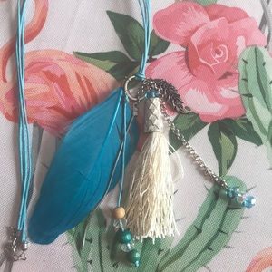 Teal longer feather necklace made in Athens Greece
